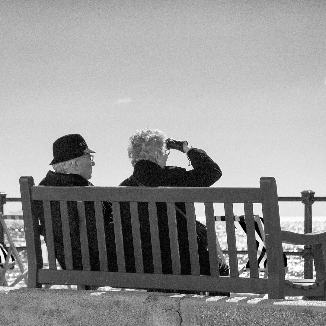 two older people on a bench