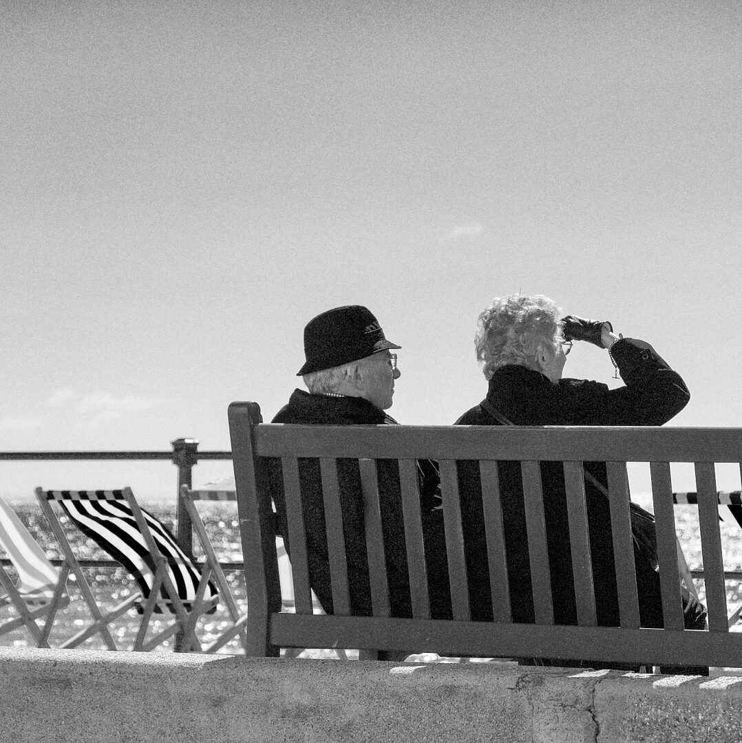 two older people on a bench