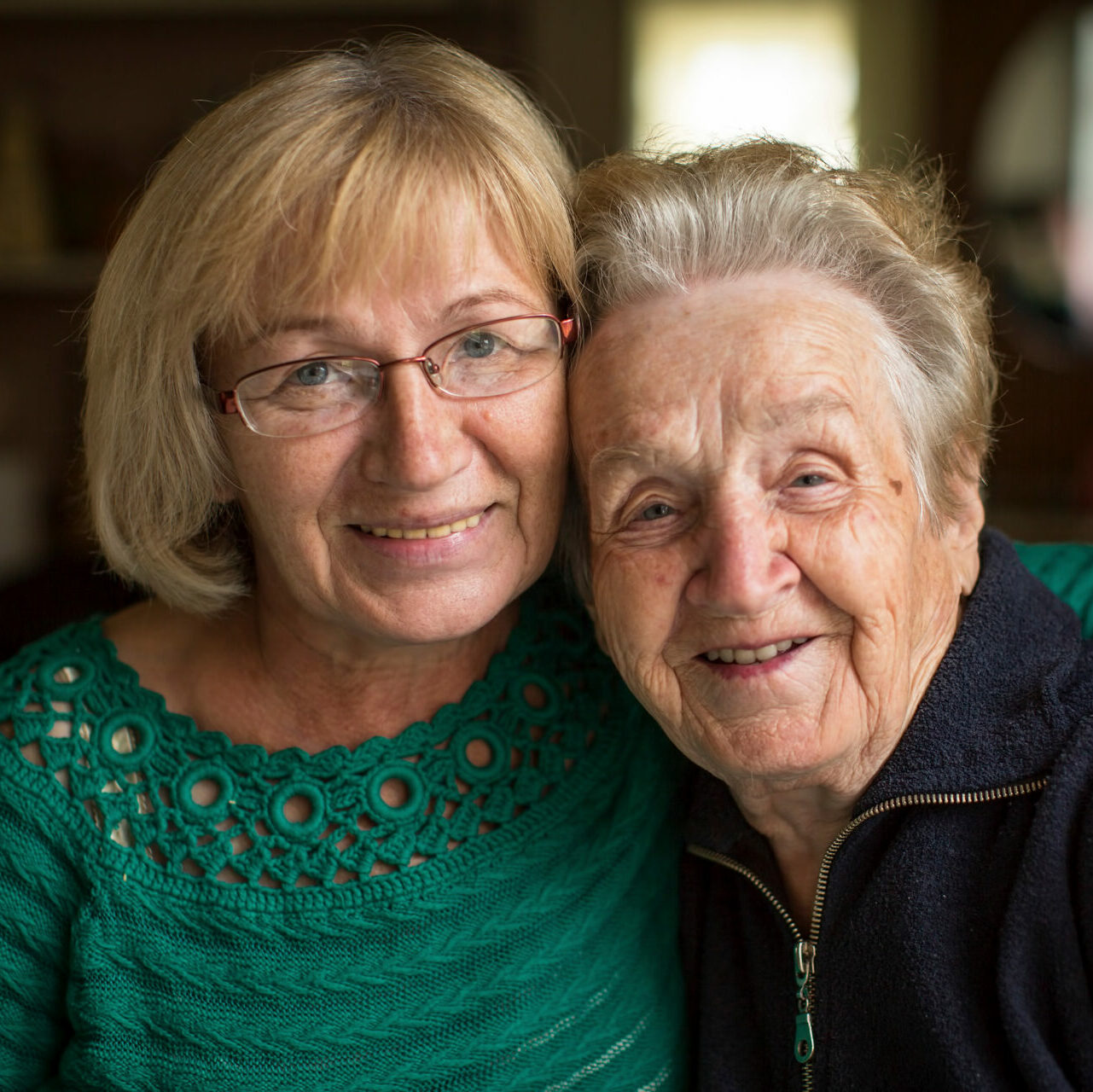 Younger and older woman hugging